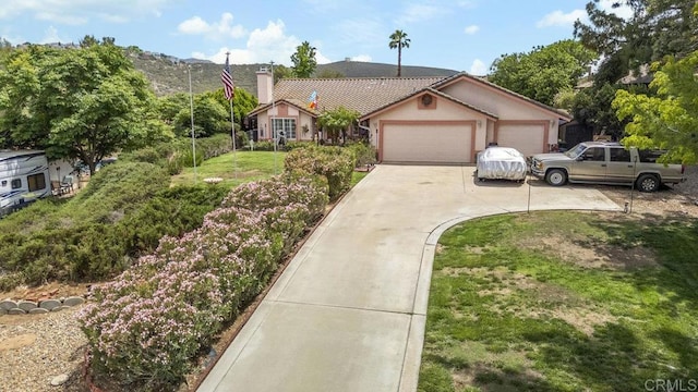 16110 Oak Springs Dr, Ramona, CA 92065 - view of front of home featuring concrete driveway, a garage, a chimney, and stucco siding