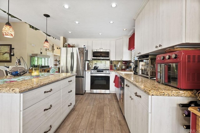 16110 Oak Springs Dr, Ramona, CA 92065 - kitchen with stainless steel appliances, light wood finished floors, white cabinetry, tasteful backsplash, and hanging light fixtures
