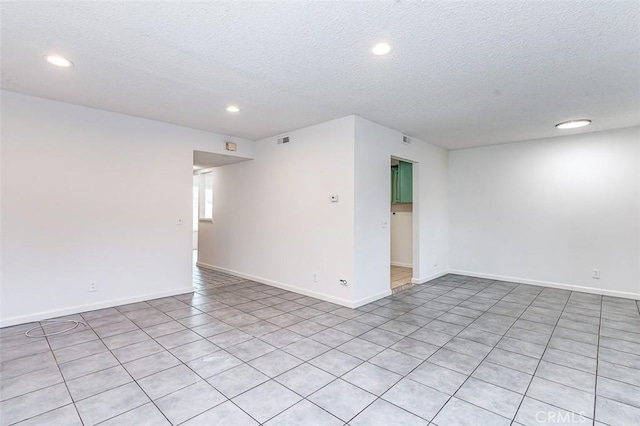 4785 Larwin Ave, Cypress, CA 90630 - unfurnished room with a textured ceiling, recessed lighting, and light tile patterned floors