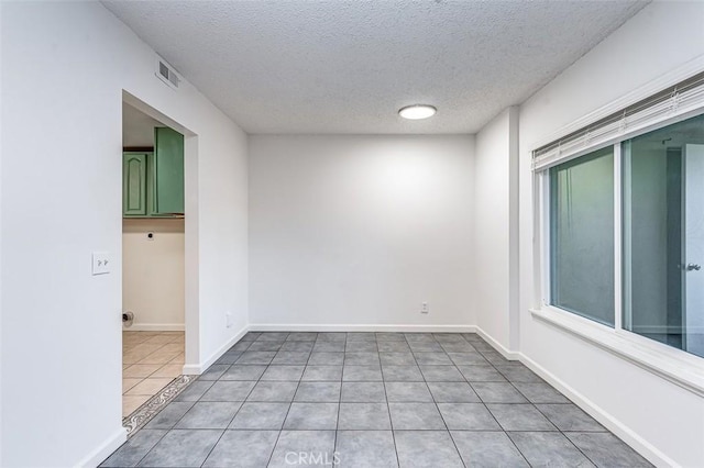 4785 Larwin Ave, Cypress, CA 90630 - tiled empty room featuring a textured ceiling