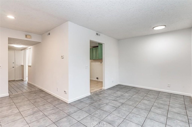 4785 Larwin Ave, Cypress, CA 90630 - tiled spare room featuring a textured ceiling and recessed lighting