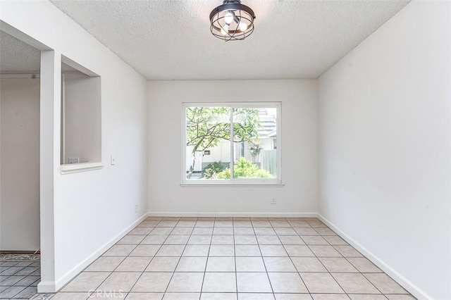 4785 Larwin Ave, Cypress, CA 90630 - unfurnished room with a textured ceiling and light tile patterned flooring