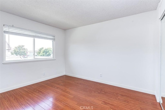 4785 Larwin Ave, Cypress, CA 90630 - empty room featuring wood finished floors and a textured ceiling