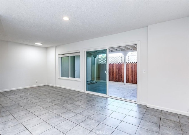4785 Larwin Ave, Cypress, CA 90630 - spare room featuring a textured ceiling, recessed lighting, and light tile patterned flooring