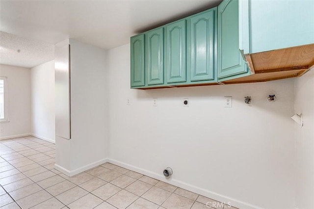 4785 Larwin Ave, Cypress, CA 90630 - laundry area with cabinet space, light tile patterned flooring, gas dryer hookup, and hookup for an electric dryer