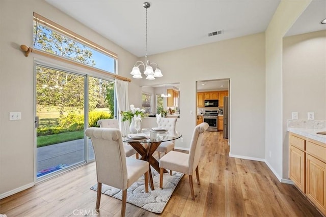 534 Misty View Way, Nipomo, CA 93444 - dining space with light wood-style flooring, a chandelier, and a high ceiling