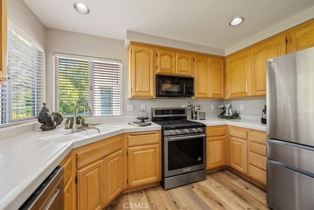 534 Misty View Way, Nipomo, CA 93444 - kitchen with stainless steel appliances, tile countertops, light wood-style floors, recessed lighting, and light brown cabinetry