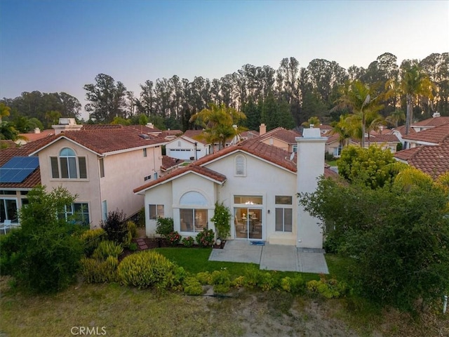534 Misty View Way, Nipomo, CA 93444 - back of house with stucco siding, a patio, a chimney, and french doors
