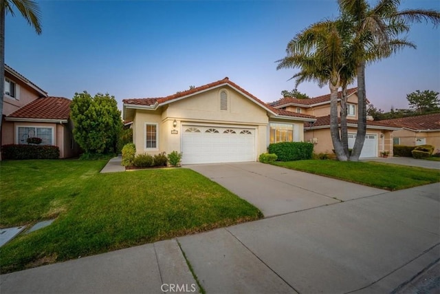 534 Misty View Way, Nipomo, CA 93444 - view of front of property with driveway, a front yard, stucco siding, and an attached garage