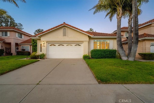 534 Misty View Way, Nipomo, CA 93444 - view of front facade with concrete driveway, a garage, stucco siding, a front yard, and a tiled roof