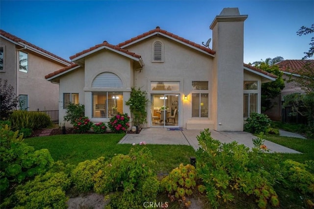 534 Misty View Way, Nipomo, CA 93444 - rear view of house featuring a patio area, stucco siding, a chimney, and a tile roof