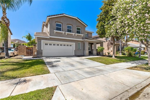 4735 Cassiope Ct, Hemet, CA 92545 - traditional-style house with stucco siding, a garage, and driveway