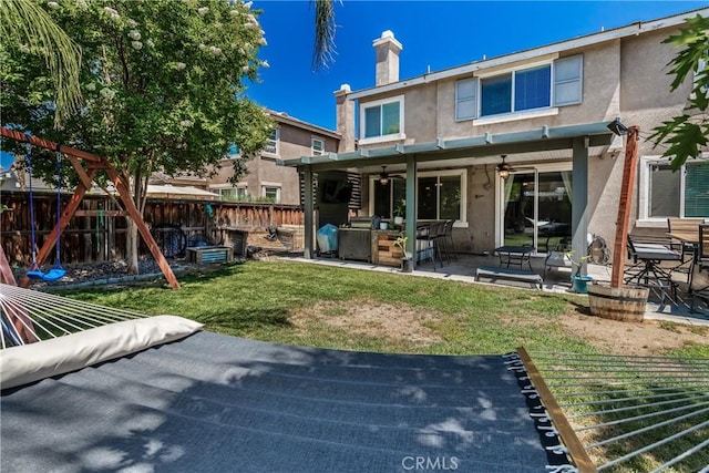 4735 Cassiope Ct, Hemet, CA 92545 - back of property with ceiling fan, stucco siding, a fenced backyard, and a patio
