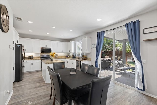 4735 Cassiope Ct, Hemet, CA 92545 - dining area featuring light wood-style floors and recessed lighting