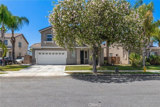 4735 Cassiope Ct, Hemet, CA 92545 - view of property hidden behind natural elements with driveway, an attached garage, and stucco siding