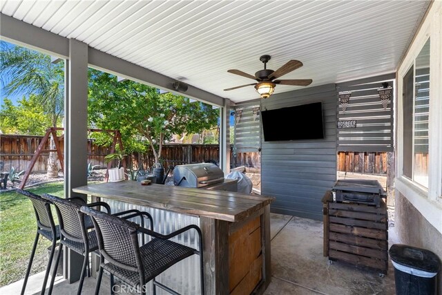 4735 Cassiope Ct, Hemet, CA 92545 - fenced backyard with a grill, a ceiling fan, and a patio