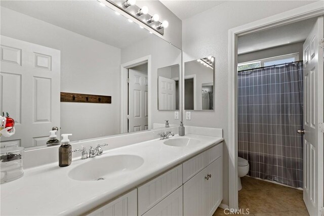 4735 Cassiope Ct, Hemet, CA 92545 - bathroom with double vanity and tile patterned flooring