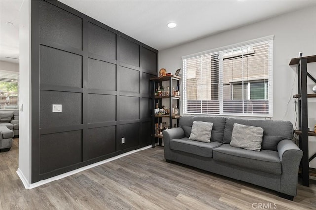 4735 Cassiope Ct, Hemet, CA 92545 - living area featuring a decorative wall, light wood-style flooring, and recessed lighting