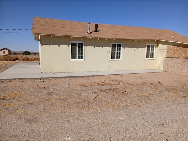 37712 210th St E, Palmdale, CA 93591 - rear view of property featuring stucco siding