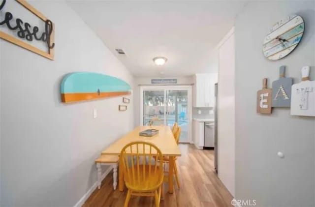 4213 Lonnie St, Oceanside, CA 92056 - dining space with light wood finished floors and baseboards