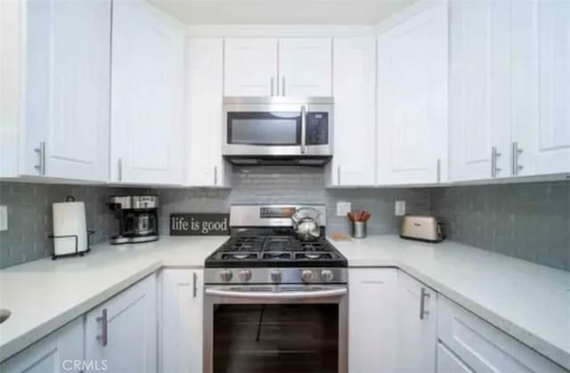 4213 Lonnie St, Oceanside, CA 92056 - kitchen featuring stainless steel appliances, white cabinetry, and light countertops