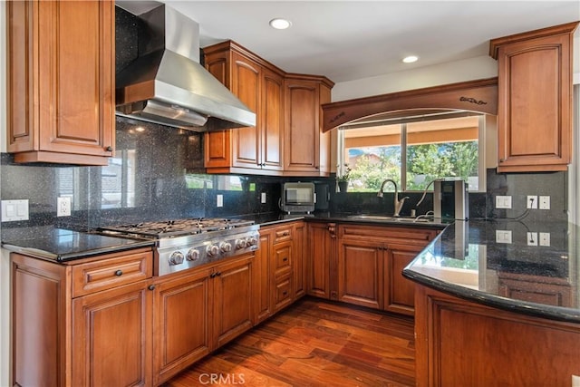 6966 Crest Rd, Rancho Palos Verdes, CA 90275 - kitchen with wall chimney range hood, stainless steel gas cooktop, dark wood finished floors, brown cabinets, and recessed lighting
