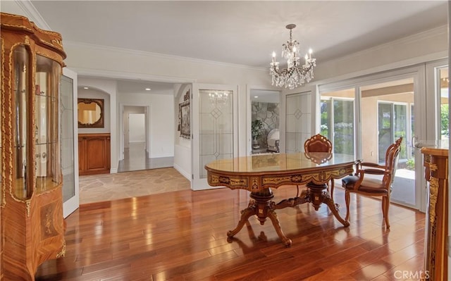 6966 Crest Rd, Rancho Palos Verdes, CA 90275 - dining area with a chandelier, light wood-style flooring, and crown molding