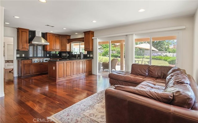 6966 Crest Rd, Rancho Palos Verdes, CA 90275 - kitchen featuring wall chimney range hood, open floor plan, stainless steel gas cooktop, dark countertops, and recessed lighting