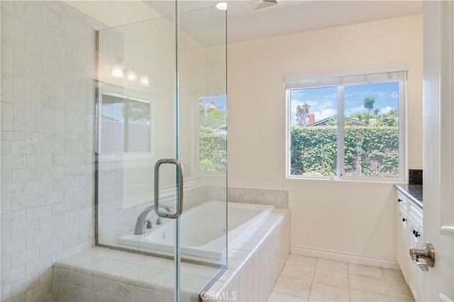 6966 Crest Rd, Rancho Palos Verdes, CA 90275 - full bathroom with vanity, a relaxing tiled tub, plenty of natural light, and tile patterned floors