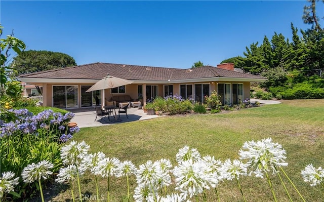 6966 Crest Rd, Rancho Palos Verdes, CA 90275 - back of property featuring a chimney, a lawn, a patio, and stucco siding