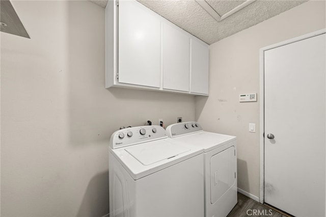 43922 Warner Trl, Palm Desert, CA 92211 - washroom featuring washing machine and clothes dryer, cabinet space, attic access, a textured ceiling, and dark wood-style flooring