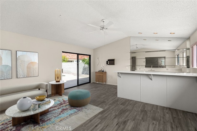 43922 Warner Trl, Palm Desert, CA 92211 - living room with wood finished floors, lofted ceiling, a textured ceiling, and a ceiling fan
