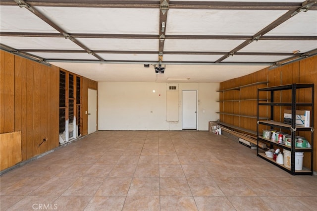 43922 Warner Trl, Palm Desert, CA 92211 - garage with a garage door opener and wooden walls