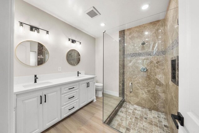 6082 Highland Ave, Yorba Linda, CA 92886 - full bathroom with a stall shower, double vanity, wood finished floors, and recessed lighting