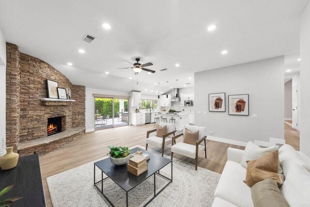 6082 Highland Ave, Yorba Linda, CA 92886 - living room with a ceiling fan, a stone fireplace, light wood-type flooring, and recessed lighting