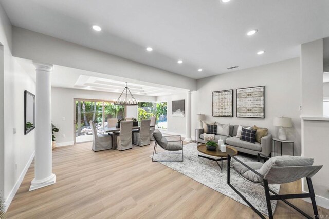 6082 Highland Ave, Yorba Linda, CA 92886 - living room featuring ornate columns, light wood finished floors, recessed lighting, and a chandelier