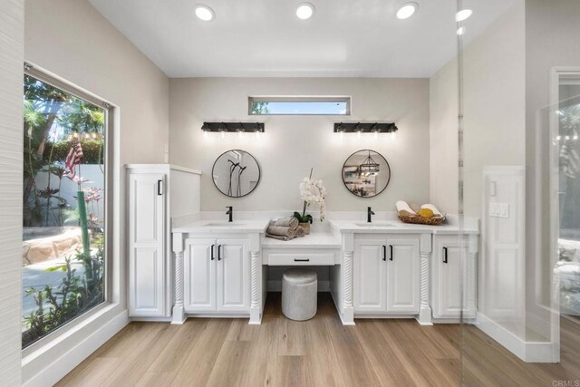 6082 Highland Ave, Yorba Linda, CA 92886 - bathroom featuring double vanity, wood finished floors, and recessed lighting
