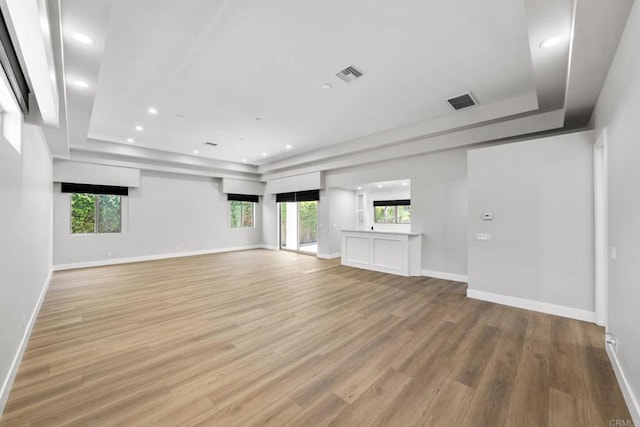 6082 Highland Ave, Yorba Linda, CA 92886 - empty room with a raised ceiling, light wood finished floors, healthy amount of natural light, and recessed lighting