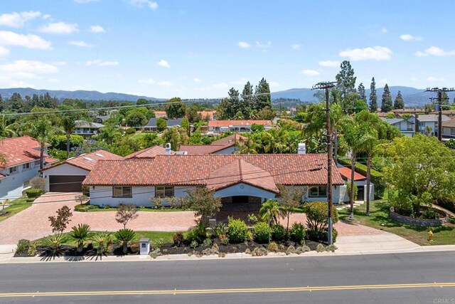 6082 Highland Ave, Yorba Linda, CA 92886 - view of front of property featuring a tile roof, a mountain view, a garage, and decorative driveway