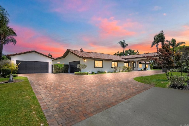 6082 Highland Ave, Yorba Linda, CA 92886 - view of front of property with decorative driveway, a garage, stucco siding, and a tiled roof
