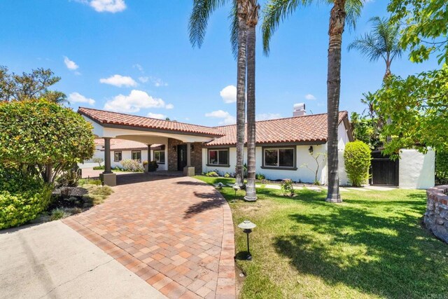 6082 Highland Ave, Yorba Linda, CA 92886 - view of front of property with a tile roof, stucco siding, a front yard, and a chimney
