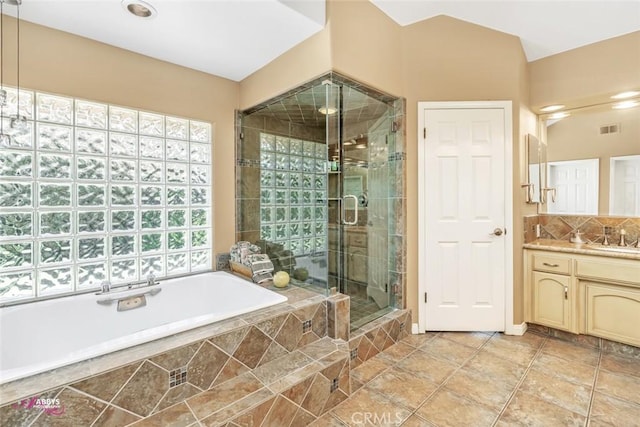3208 Bridlewood Ct, Bakersfield, CA 93311 - full bath with vanity, a garden tub, a shower stall, and tasteful backsplash