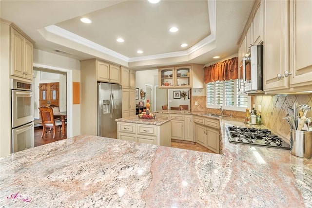 3208 Bridlewood Ct, Bakersfield, CA 93311 - kitchen featuring appliances with stainless steel finishes, a raised ceiling, light stone counters, recessed lighting, and tasteful backsplash