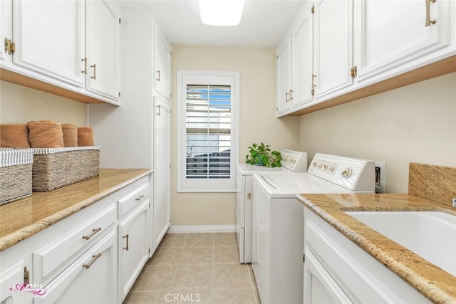 3208 Bridlewood Ct, Bakersfield, CA 93311 - laundry room with separate washer and dryer, cabinet space, and light tile patterned floors