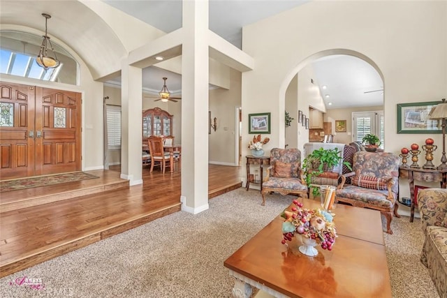 3208 Bridlewood Ct, Bakersfield, CA 93311 - carpeted living area featuring lofted ceiling, arched walkways, and ceiling fan