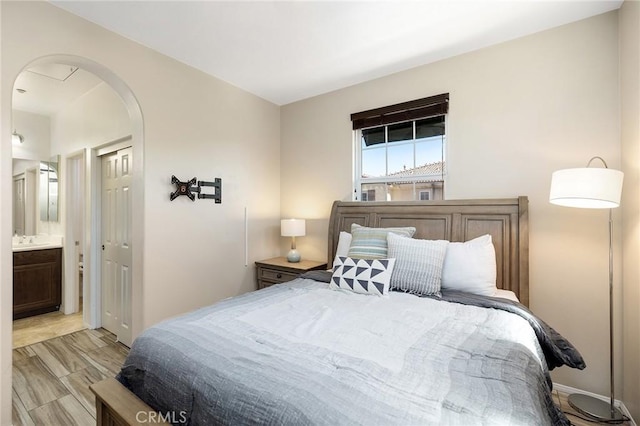 31186 Lavender Ct Unit 164, Temecula, CA 92592 - bedroom with arched walkways and ensuite bath