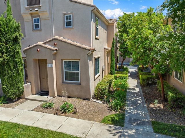 31186 Lavender Ct Unit 164, Temecula, CA 92592 - view of front of home featuring stucco siding and a tiled roof