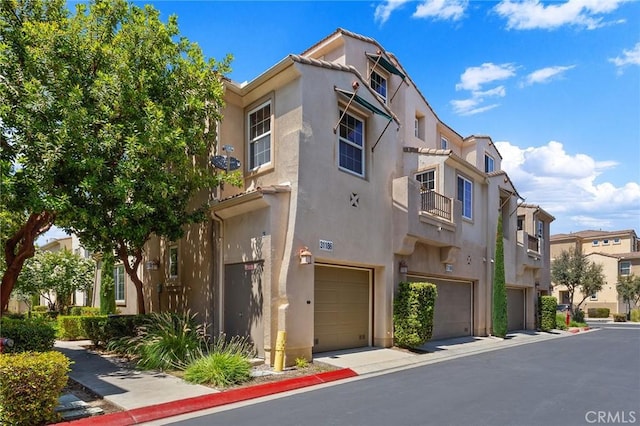 31186 Lavender Ct Unit 164, Temecula, CA 92592 - view of property with a garage and a residential view