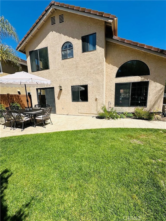 3931 Cottonwood Grove Trl, Calabasas, CA 91301 - rear view of house featuring stucco siding, a patio area, and a tiled roof