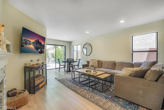 3931 Cottonwood Grove Trl, Calabasas, CA 91301 - living room featuring a fireplace, light wood-type flooring, and recessed lighting
